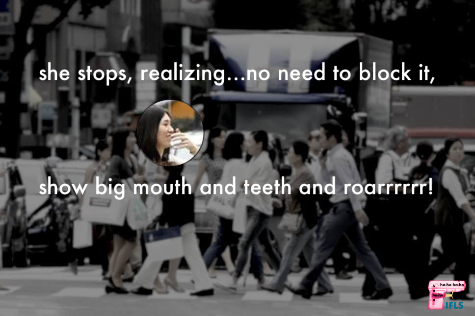 woman in a crowd covers mouth laughing